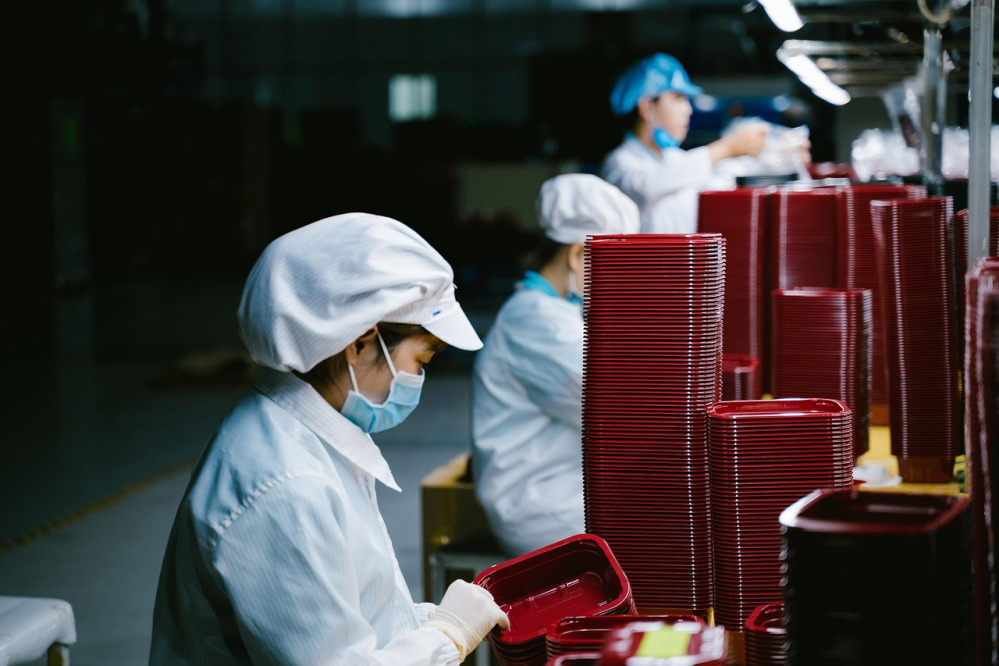 factory worker assembly line automotive production